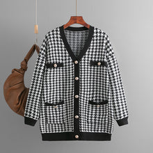 Load image into Gallery viewer, v-neck button cardigan women, Oversized v-neck cardigan with pockets , black houndstooth pattern and gold pearl buttons, cozy layering sweater women wear for fall brunch or campus outfits, pearl button cardigan, classy fall outfits with cardigan, chunky knit cardigan for layering, houndstooth sweater jacket women.