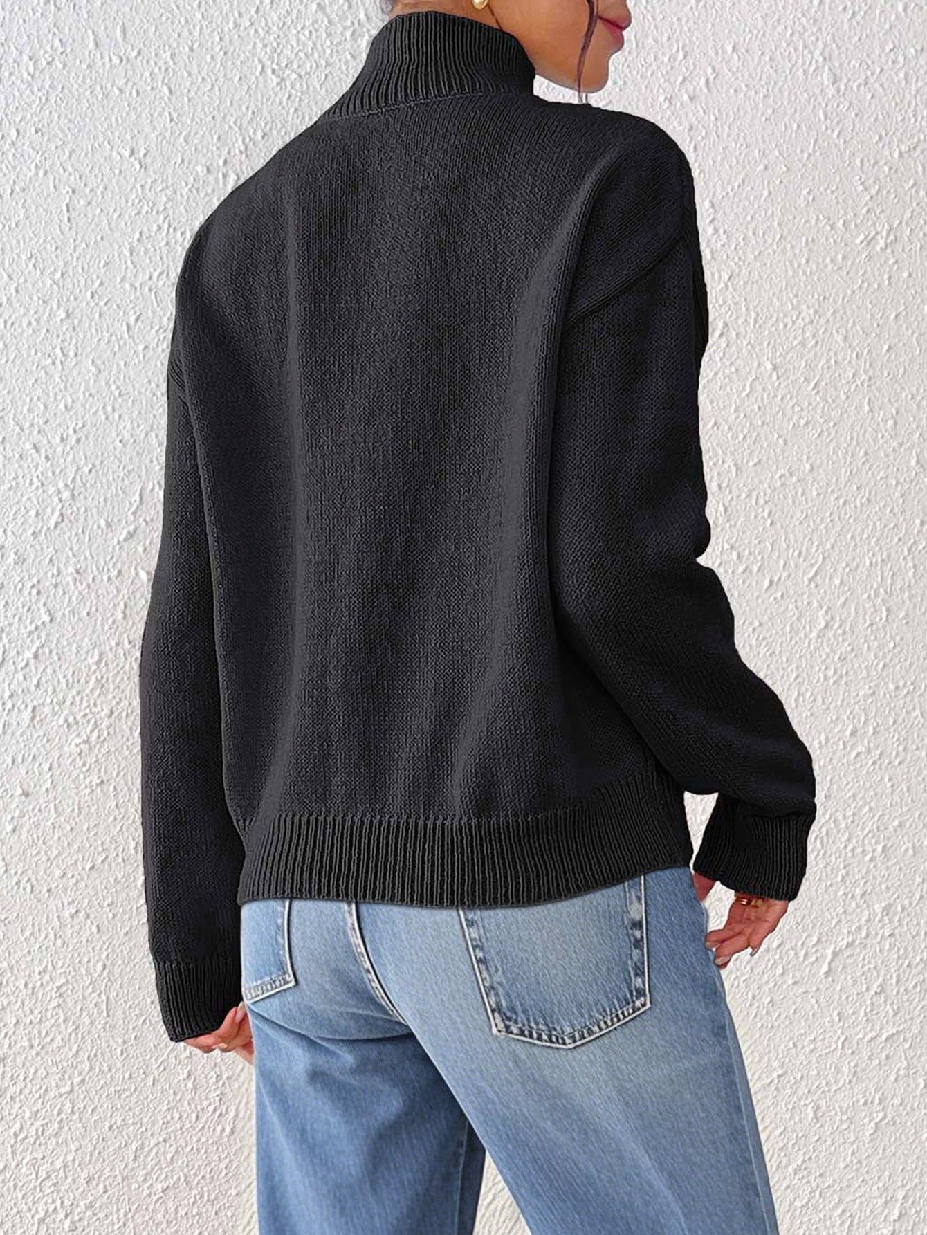 Black high-neck wool-blend sweater with daisy buttons, cozy fall knit top for women, soft girl aesthetic outfit, quiet luxury sweater perfect for winter layering and casual workwear.