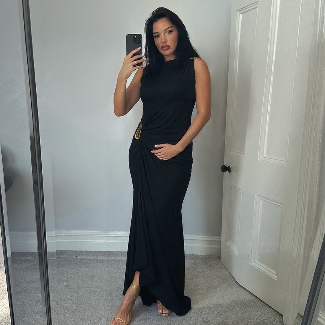 black asymmetric draped maxi dress women, black wedding guest dress women, black draped bodycon maxi dress for evening parties and cocktails, elegant cocktail dress, black maxi dress women, gold accent black formal dress for gala, classy dresses for evening party.