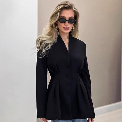 black tailored blazer for women, fitted black blazer for women office wear, sculpted waist blazer, sculpted waist black blazer women’s jacket showing the cinched pleated waist, V-neck collarless neckline, and long sleeves a tailored black blazer perfect for business meetings or night events.