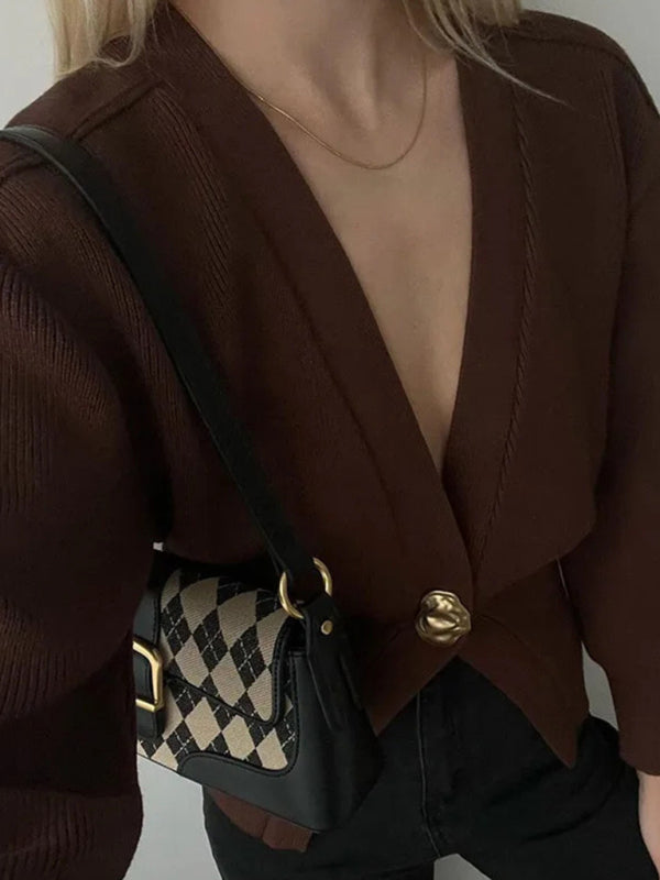 Trendy fall cardigan for women featuring deep V-neckline, puff sleeves, and cinched waist quiet luxury knitwear for effortless autumn outfits, workwear layering, and coffee-date style.