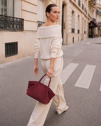 Quiet luxury tote bag with a relaxed shoulder tote bag women silhouette, faux suede texture, belted side trim, and spacious interior, designed for an airport travel tote bag and weekend getaways.