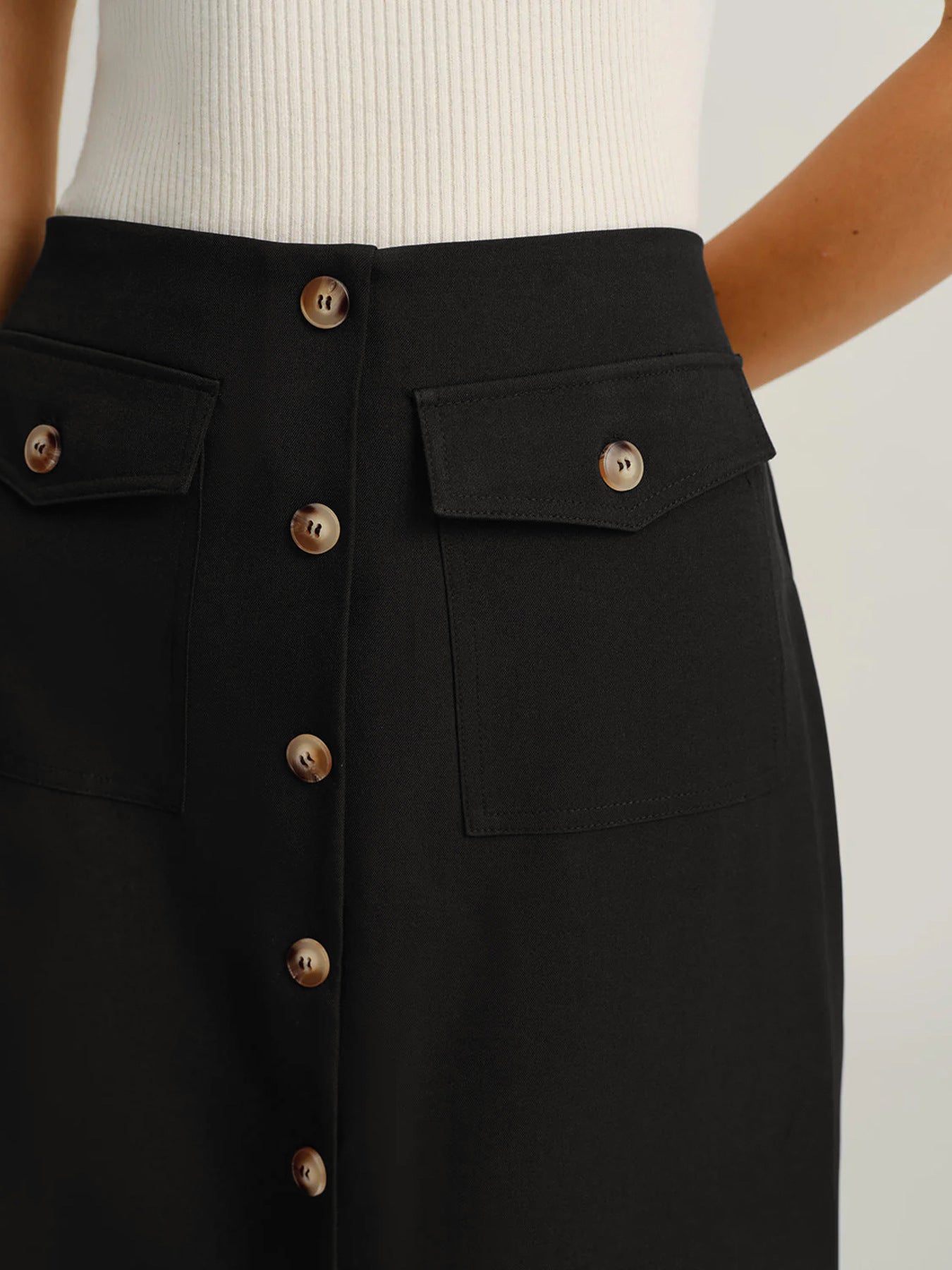 High waist black skirt women, structured fabric with front buttons and clean waistband design, elongating straight silhouette, black midi skirt outfit for work women, ideal for office outfits