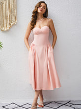 Load image into Gallery viewer, corset midi dress, fit and flare dress, pleated dress, pink corset dress, corset wedding guest dress, fit and flare cocktail dress, prom and dance dress, prom dress, plunging neckline dress, backless sundress, spring dresses for women, swing dresses for women, pink cocktail dress, classy dresses, fit and flair wedding guest dress. 