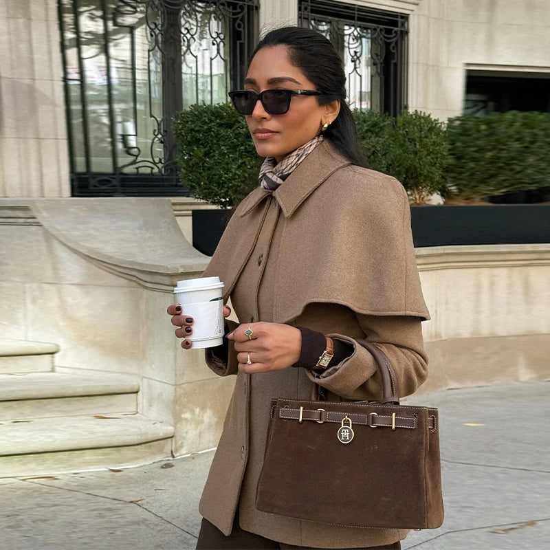 cape blazer jacket women, business casual jacket, cape collar jacket coat, office wear jacket, Tailored jacket women with cape overlay shoulders, elegant single breasted cape jacket, hip length structured fit, elevated quiet luxury jacket aesthetic for workwear and classy casual outfits.