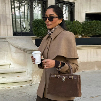 cape blazer jacket women, business casual jacket, cape collar jacket coat, office wear jacket, Tailored jacket women with cape overlay shoulders, elegant single breasted cape jacket, hip length structured fit, elevated quiet luxury jacket aesthetic for workwear and classy casual outfits.