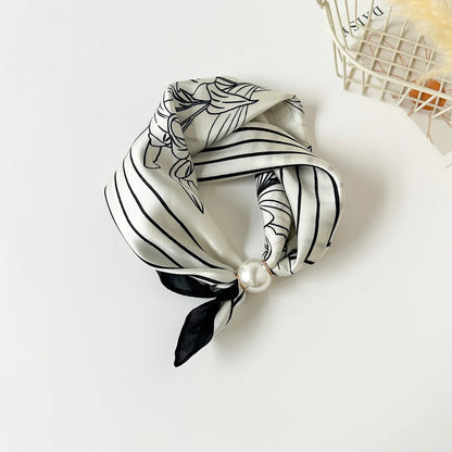 Printed faux silk neck scarf with a magnetic pearl fastening, perfect for women looking for an easy-to-wear scarf necklace to pair with blazers, shirts, and knitwear.