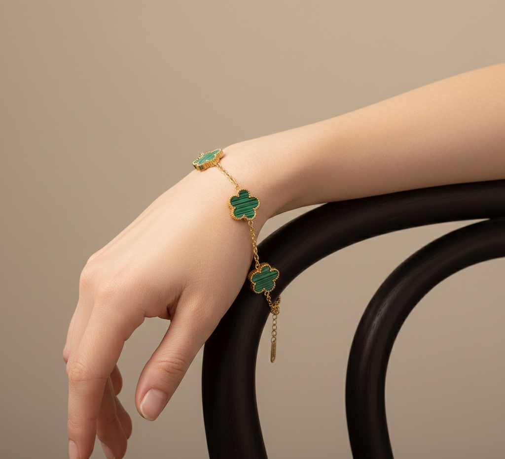 gold clover jewelry set women, clover necklace bracelet earrings set, Matching jewelry set with enamel clover charms, smooth resin texture paired with gold charm jewelry set styling, balanced motif placement, clover necklace bracelet earrings set women, office wear jewelry look, quiet luxury accessories.