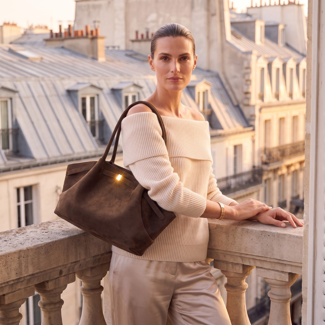Work tote bag laptop with a structured oversized slouchy tote profile, soft velvety finish, gold hardware accents, and spacious storage, perfect for a faux suede business casual tote bag.