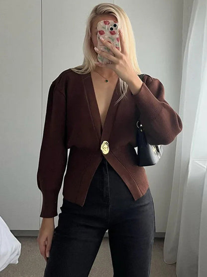 women’s fall sweater, Trendy fall cardigan for women featuring deep V-neckline, puff sleeves, and cinched waist quiet luxury knitwear for effortless autumn outfits, workwear layering, and coffee-date style, capsule wardrobe sweater, Pinterest outfit cardigan.