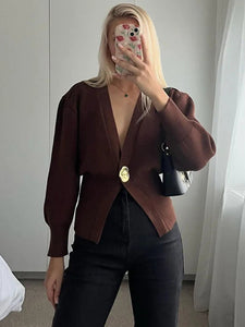women’s fall sweater, Trendy fall cardigan for women featuring deep V-neckline, puff sleeves, and cinched waist quiet luxury knitwear for effortless autumn outfits, workwear layering, and coffee-date style, capsule wardrobe sweater, Pinterest outfit cardigan.
