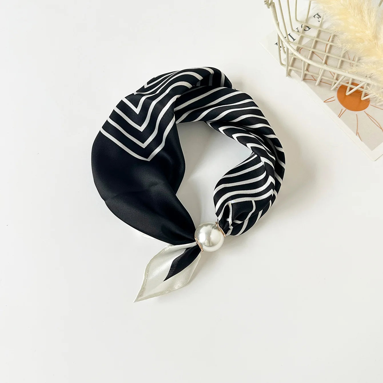 Lightweight faux silk fashion scarf with a decorative floral print and magnetic pearl clasp, designed for women seeking versatile neck accessories for work, travel, and everyday outfits.