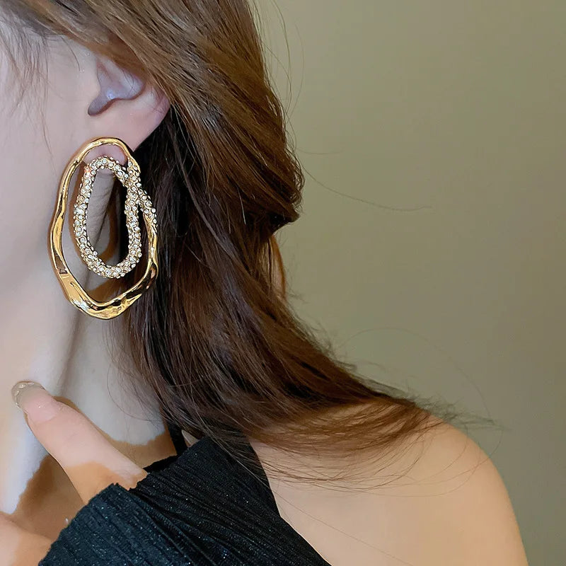 gold hoops, diamond stud earrings, Hypoallergenic pavé crystal oval earrings for women, statement jewelry in gold or silver tones, lightweight sculptural design, modern USA fashion accessory.