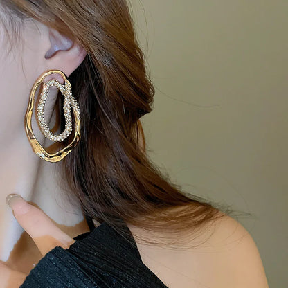 gold hoops, diamond stud earrings, Hypoallergenic pavé crystal oval earrings for women, statement jewelry in gold or silver tones, lightweight sculptural design, modern USA fashion accessory.