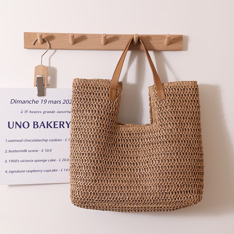 straw beach tote bag, resort tote bag, chic vacation straw bag, Women's straw bag with basket weave bag texture and relaxed tote silhouette, raffia straw bag aesthetic styled as boho straw tote bag, effortless summer outing bag for coastal brunch plans.