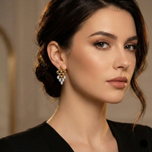 Load image into Gallery viewer, fashion earrings women, elegant drop earrings, classy gold earrings, gold accessory trends. Geometric gold dangle earrings with sparkling crystal stones and a sleek rhombus shape. Lightweight fashion earrings for women, ideal for workwear, party wear, weddings, and elegant night-out looks.