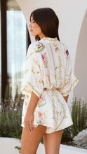 Load image into Gallery viewer, floral mini romper, pastel playsuit for wedding guest, short sleeve summer romper, affordable floral romper, brunch party outfit