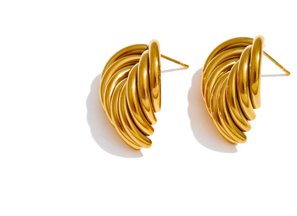 Chunky sculptural gold earrings with an intertwined knot silhouette designed for versatile day-to-night styling.