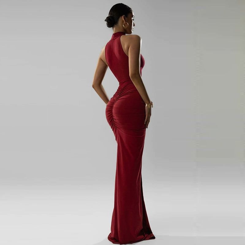 halter high neck bodycon dress, Burgundy high neck evening gown for party featuring ruched maxi dress women shaping, sculpted hourglass maxi gown for formal events, classic full length gown women with slit detail and sleek sleeveless evening gown style.
