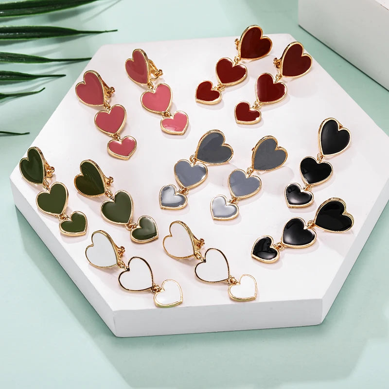 heart earrings, dangle heart shaped earrings, heart shaped clip on earrings, clip on earrings, dangle earrings, drop heart earrings, heart drop earrings, non pierced earrings, jewelry earrings, drop earrings.