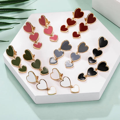 heart earrings, dangle heart shaped earrings, heart shaped clip on earrings, clip on earrings, dangle earrings, drop heart earrings, heart drop earrings, non pierced earrings, jewelry earrings, drop earrings.