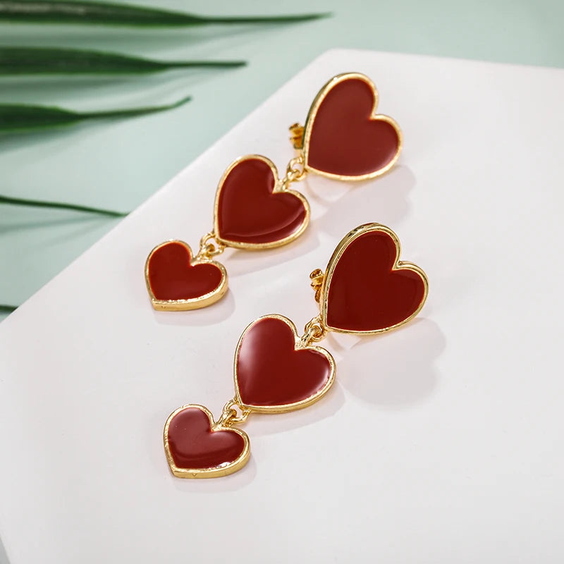 heart earrings, dangle heart shaped earrings, heart shaped clip on earrings, clip on earrings, dangle earrings, drop heart earrings, heart drop earrings, non pierced earrings, jewelry earrings, drop earrings.