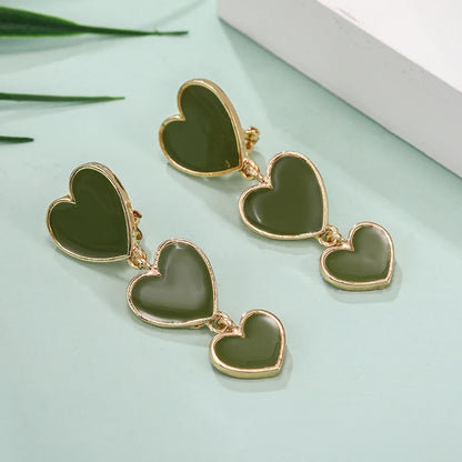 Green heart shaped earrings, drop clip on heart earring, drop heart earrings, heart drop earrings, non pierced earrings, jewelry earrings, drop earrings, long earrings, party wear earrings, fun quirky earrings for women, Pink earrings for women, 