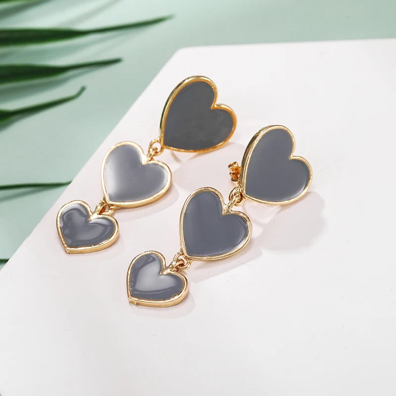 heart earrings, dangle heart shaped earrings, heart shaped clip on earrings, clip on earrings, dangle earrings, drop heart earrings, heart drop earrings, jewelry earrings, drop earrings, long earrings, party wear earrings, grey heart earrings, best clip on earrings, clip on dangle earrings, chanel clip on earrings.