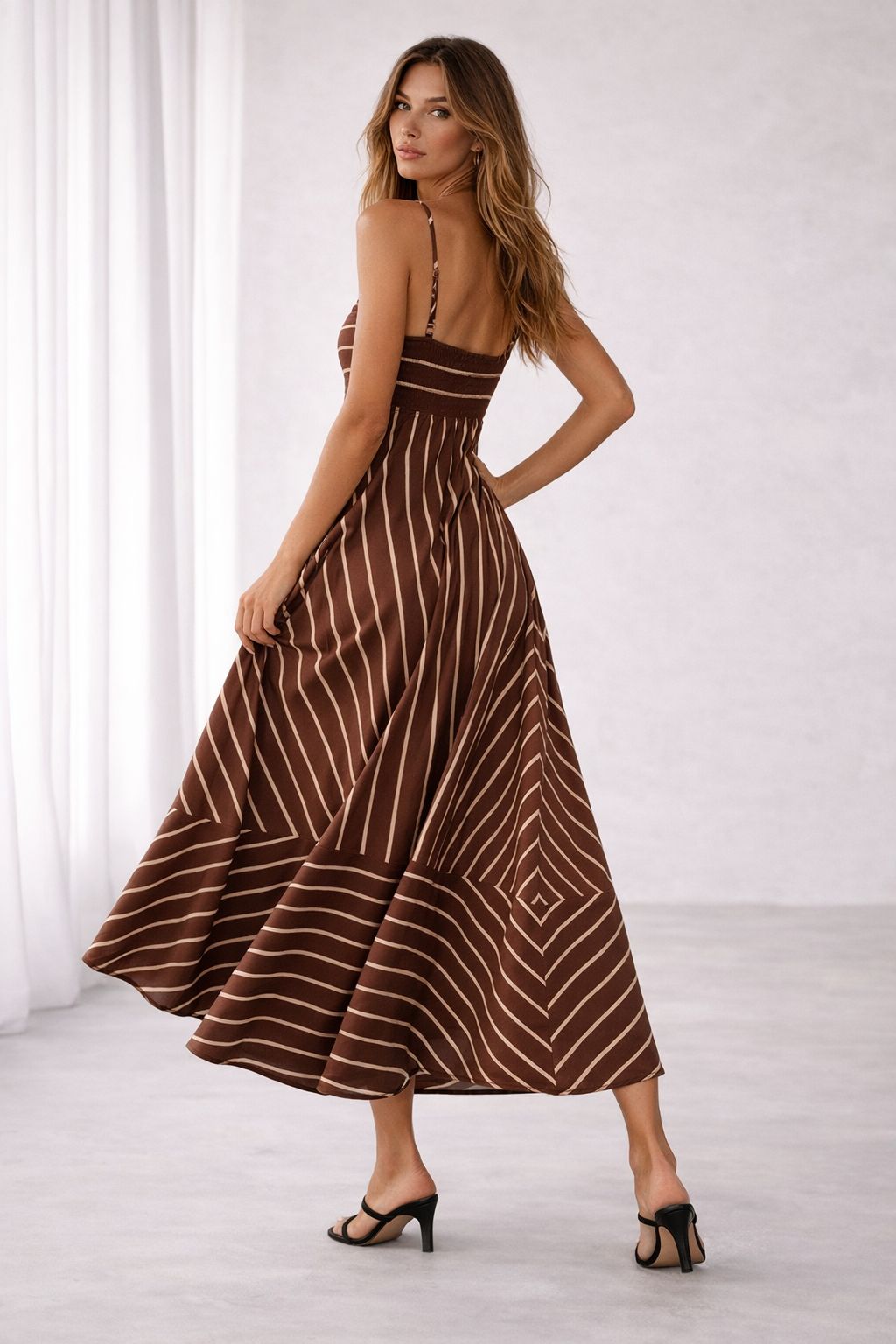 Chocolate brown cream striped flare maxi dress, Spaghetti strap fitted bodice, vertical skirt stripes, high waist flare, Quiet luxury earth tones, timeless stripe elegance, modern classic maxi dress, Cream-brown contrast, dramatic skirt volume, elongated proportions maxi.
