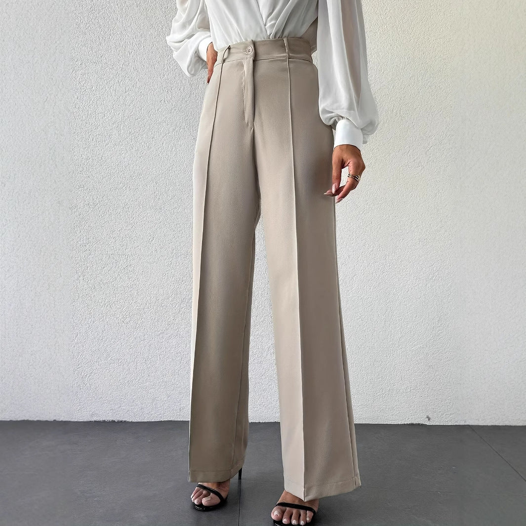 Tailored column wide-leg trousers for women, high waist neutral beige office pants, business casual French minimalist travel wardrobe essential.