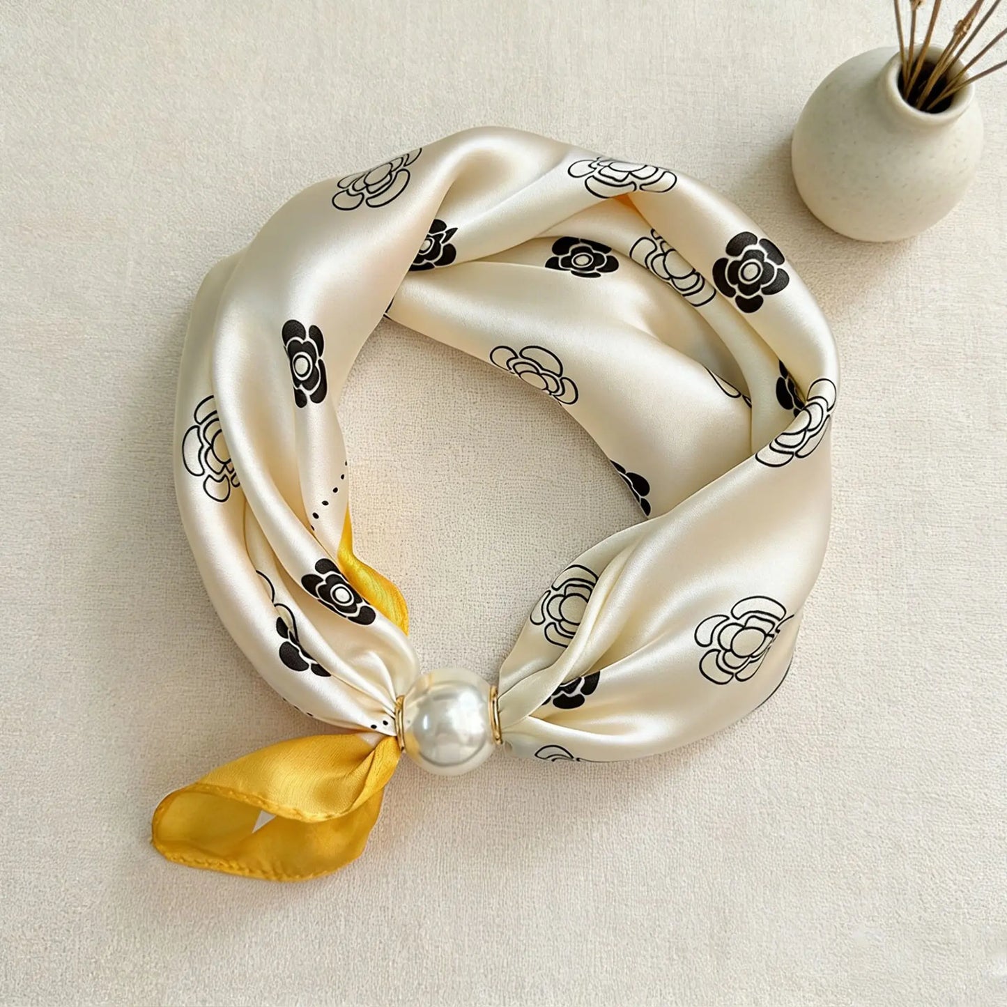 Printed faux silk neck scarf with a magnetic pearl fastening, perfect for women looking for an easy-to-wear scarf necklace to pair with blazers, shirts, and knitwear.