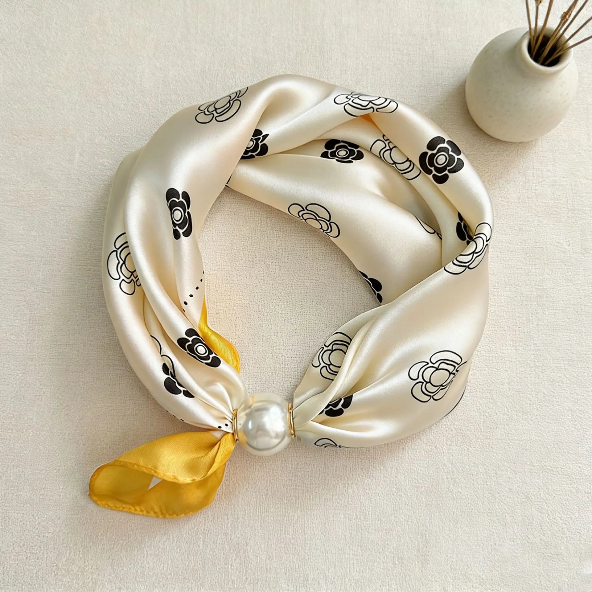 Printed faux silk neck scarf with a magnetic pearl fastening, perfect for women looking for an easy-to-wear scarf necklace to pair with blazers, shirts, and knitwear.