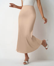 Load image into Gallery viewer, Women’s satin midi skirt with flattering drape in six colors. Elegant slip skirt styled for workwear office outfits, cocktail parties, wedding guest looks &amp; Pinterest trending chic satin outfits.