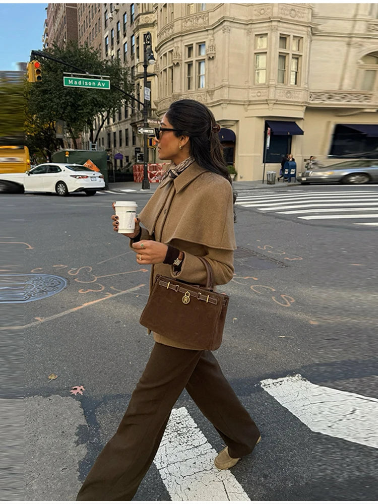 business casual jacket, lapel collar blazer jacket, Cape collar jacket women with clean tailoring, hip length tailored jacket, single breasted design, minimalist quiet luxury jacket style 