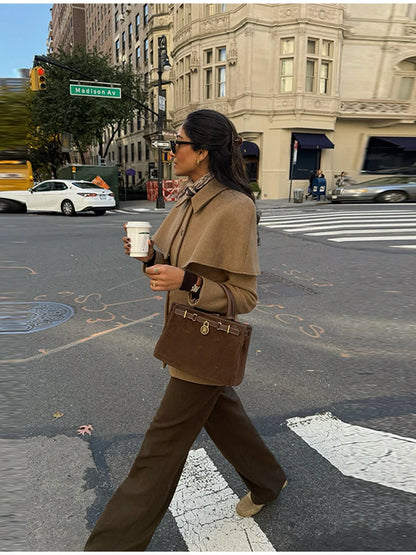 business casual jacket, lapel collar blazer jacket, Cape collar jacket women with clean tailoring, hip length tailored jacket, single breasted design, minimalist quiet luxury jacket style 