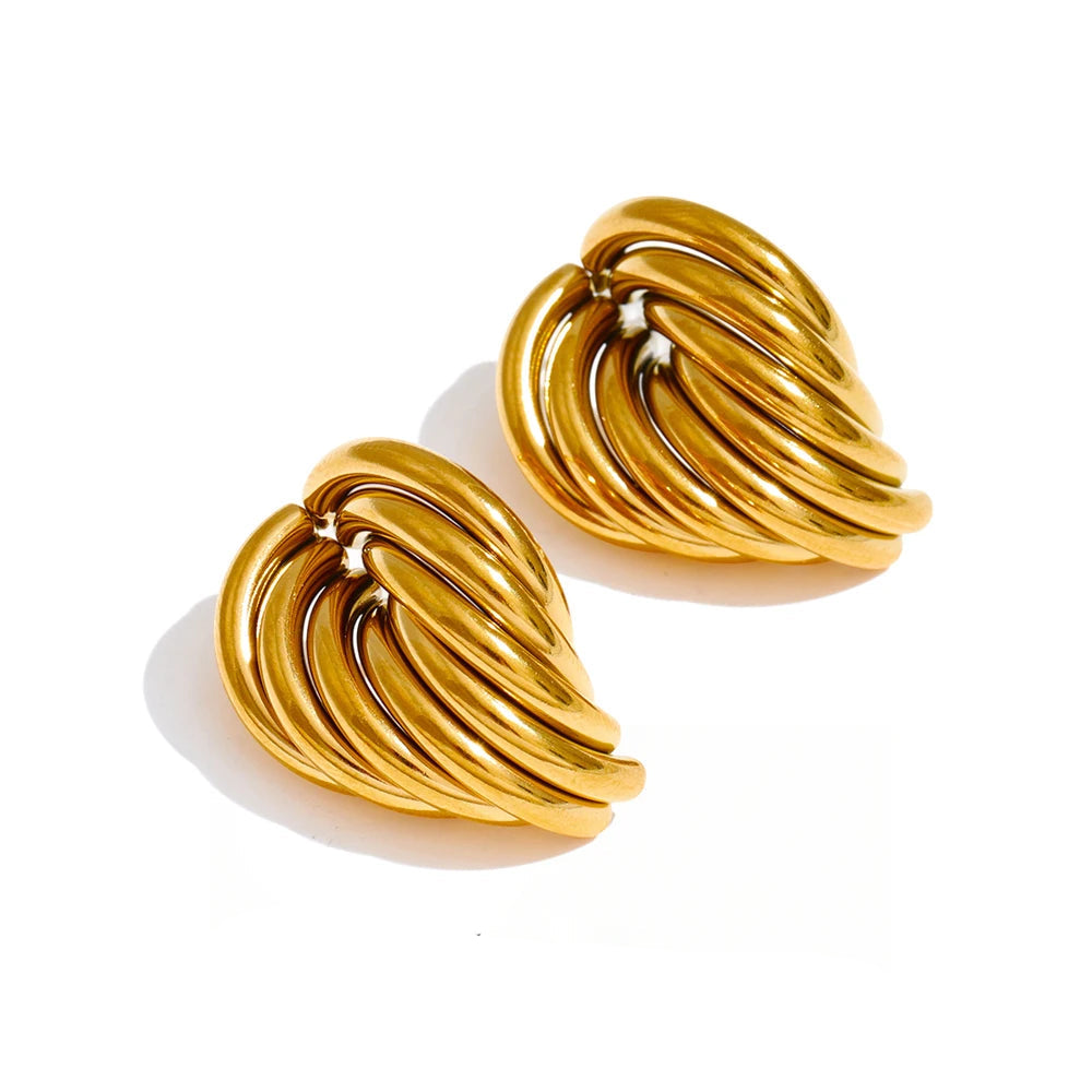 High-shine chunky gold stud earrings with a sculptural knot design perfect for capsule wardrobes and elevated casual outfits. Bold gold knot stud earrings with a smooth polished finish styled for European-inspired fashion and modern wardrobes.