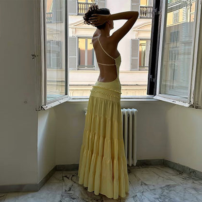 long backless  tiered maxi dress Pinterest-worthy maxi dress, summer vacation maxi dress, womens wedding guest dresses, womens party dresses, pleated tiered maxi dress, rooftop party outfit, vacation maxi dress, backless vacation maxi dress, backless beach dress.