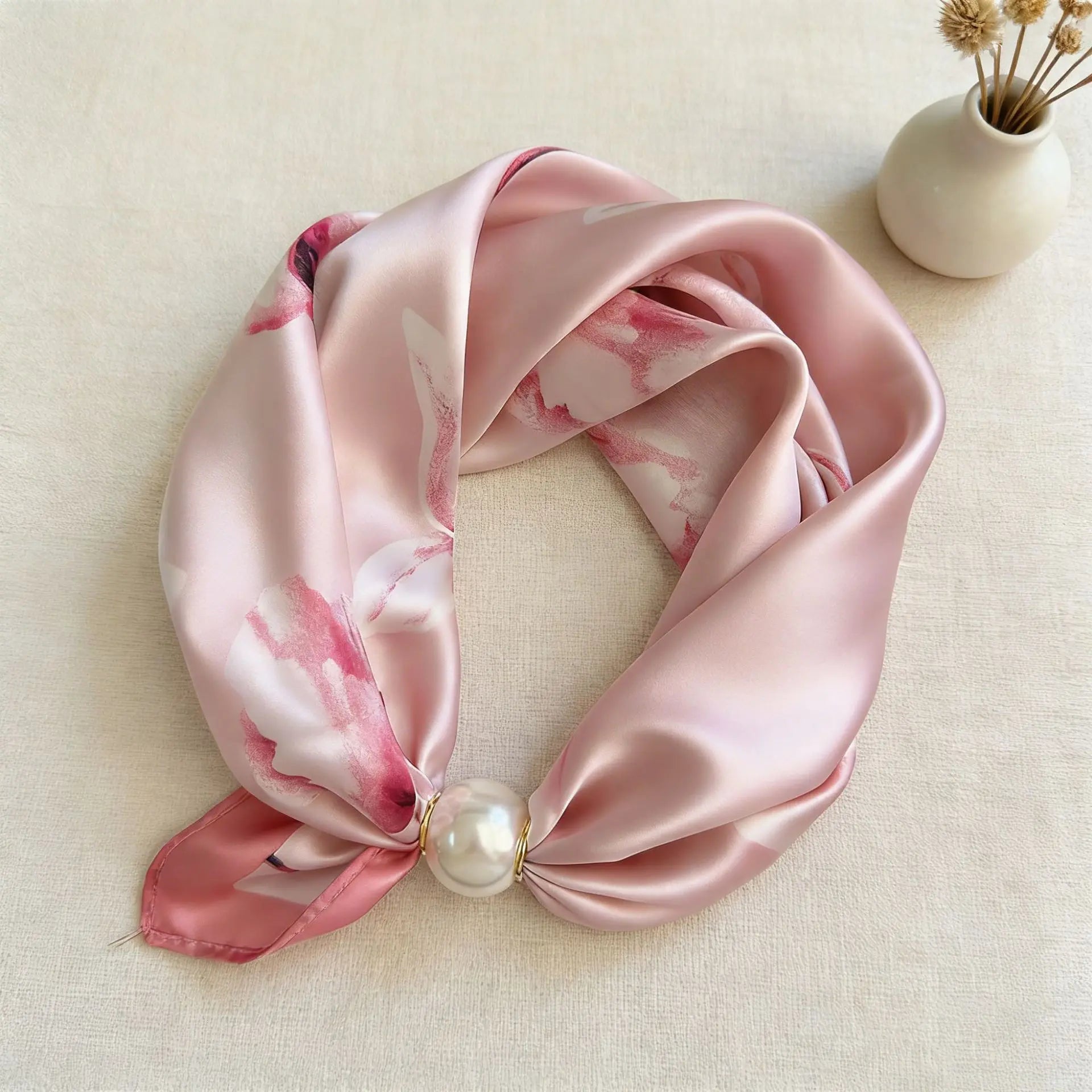 Women's silk-feel printed scarf with an integrated magnetic pearl closure, offering the polished look of a tied neck scarf without the effort for office and business casual styling.