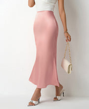 Load image into Gallery viewer, High-waist satin midi slip skirt for women, bias cut with soft sheen finish. Perfect versatile skirt for workwear, date night outfit ideas, wedding guest looks &amp; chic everyday satin styling.