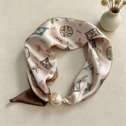 Women's silk-feel printed scarf with an integrated magnetic pearl closure, offering the polished look of a tied neck scarf without the effort for office and business casual styling.