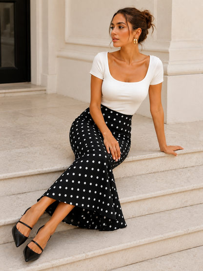 Polka dot midi skirt for women upper shape and flowing fishtail hem, for monochrome wardrobes, brunch looks and polished weekend styling for everyday, Black and white polka dot fishtail skirt with a fitted shape and graceful midi flare, styled as a chic printed skirt for a polished capsule wardrobe outfit with feminine contemporary character.