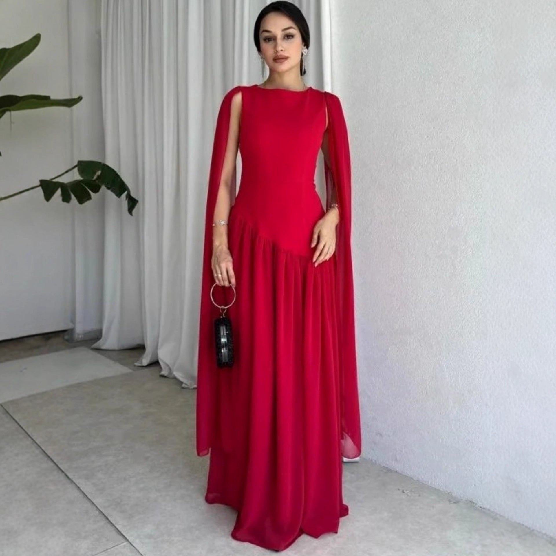 red prom dress gown, cape maxi dress, Asymmetrical Draped Dress, red maxi gown, Red Long Maxi Gown Dress, Women’s red cape sleeve evening gown in lightweight chiffon with floor length silhouette and open back design, elegant formal maxi dress for weddings, black tie events, and evening occasions.