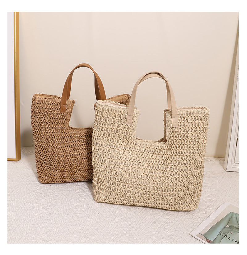 woven straw shoulder tote bag, Straw shoulder bag with basket weave bag texture and wide shoulder carry shape, natural woven bag styled as a straw bag for beach, vacation and resort, perfect casual summer tote for everyday warm-weather styling.