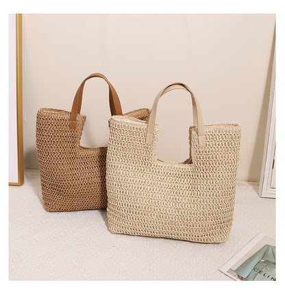 woven straw shoulder tote bag, Straw shoulder bag with basket weave bag texture and wide shoulder carry shape, natural woven bag styled as a straw bag for beach, vacation and resort, perfect casual summer tote for everyday warm-weather styling.