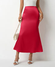 Load image into Gallery viewer, Satin midi slip skirt for women in red, ivory, pink, navy, black &amp; light pink. High waist bias cut skirt perfect as workwear outfit, wedding guest look or chic date night style.