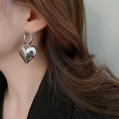 Drop Heart Earrings,  Drop Earrings, heart earrings, dangle heart shaped earrings, womens fashion jewelry, heart drop earrings, Women’s statement earrings, Quirky jewelry, Everyday earrings, Gold and silver earrings, Asymmetric earrings, Chic women’s accessories, Fun fashion accessories, Playful earrings, Chic statement jewelry, Unique women’s earrings, Everyday chic earrings