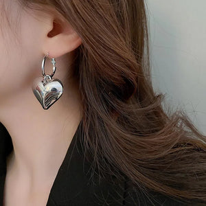Drop Heart Earrings,  Drop Earrings, heart earrings, dangle heart shaped earrings, womens fashion jewelry, heart drop earrings, Women’s statement earrings, Quirky jewelry, Everyday earrings, Gold and silver earrings, Asymmetric earrings, Chic women’s accessories, Fun fashion accessories, Playful earrings, Chic statement jewelry, Unique women’s earrings, Everyday chic earrings