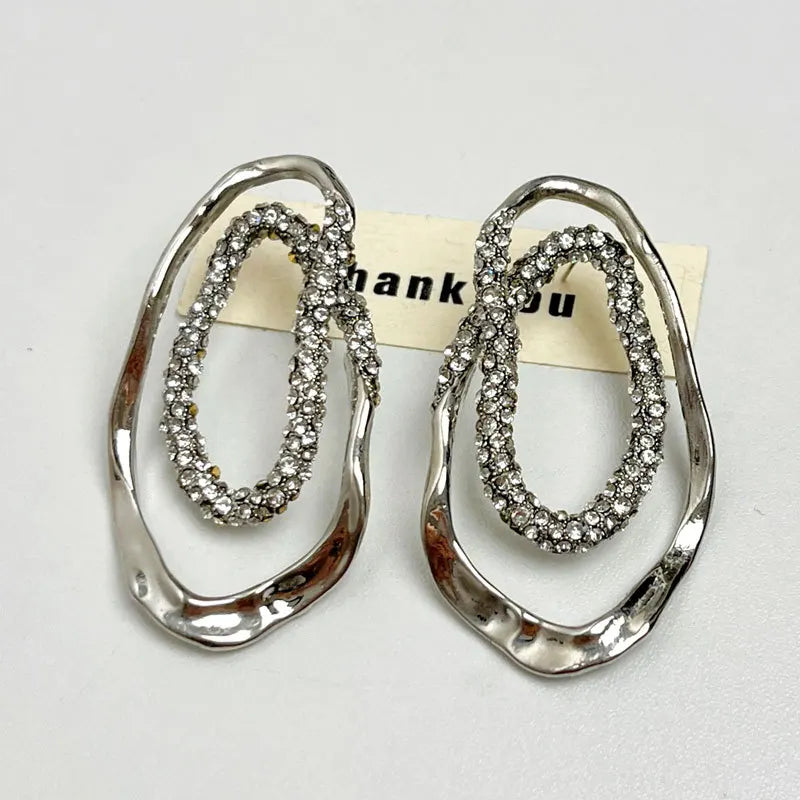 Women’s statement drop earrings in gold and silver with pavé crystals, sculptural modern design, lightweight and nickel-free, perfect jewelry for U.S. shoppers.