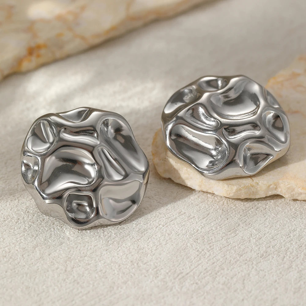 silver bold stud earrings, textured silver earrings, fashion jewelry for women, Chunky sculptural silver stud earrings with an irregular textured surface, modern statement jewelry for women who prefer bold studs over drop or dangle earrings.