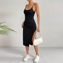 Load image into Gallery viewer, Slim fit black bodycon midi dress with slit, chic spaghetti strap little black dress under $50, cocktail outfit idea, women’s ribbed knit LBD for date night, travel dinner outfit 2025 style.